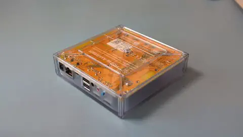 Clip showing the device from the top, then how to tilt the device and lifting the cover starting on the side away from the connectors